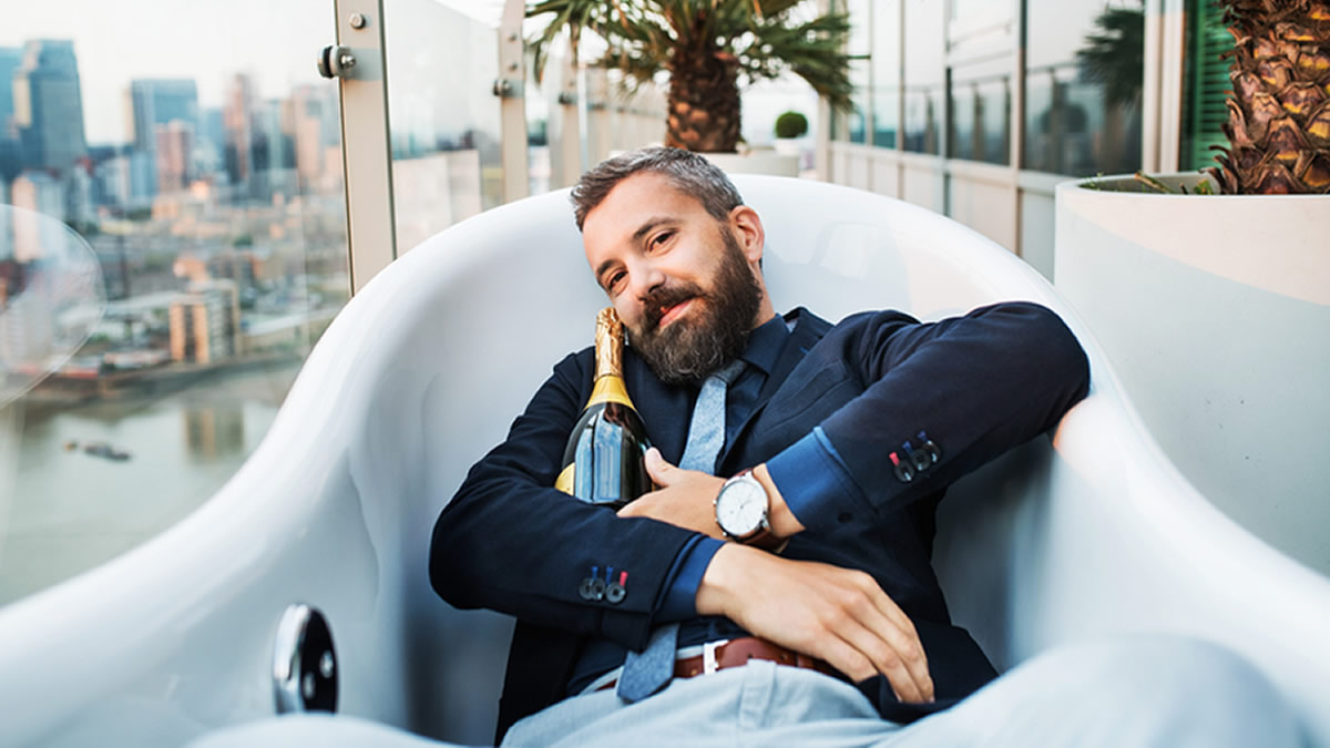 Man in tub wearing a suit